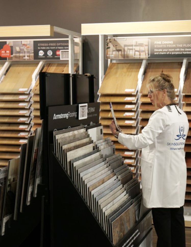 shopping for luxury vinyl floors at Carpet Studio Flooring America's Okemos showroom