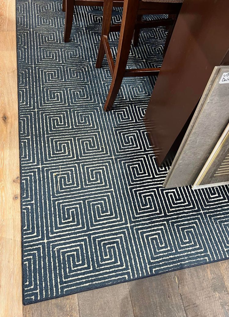black and white spiral patterned area rug