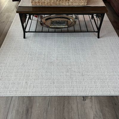 gray area rug with coffee table