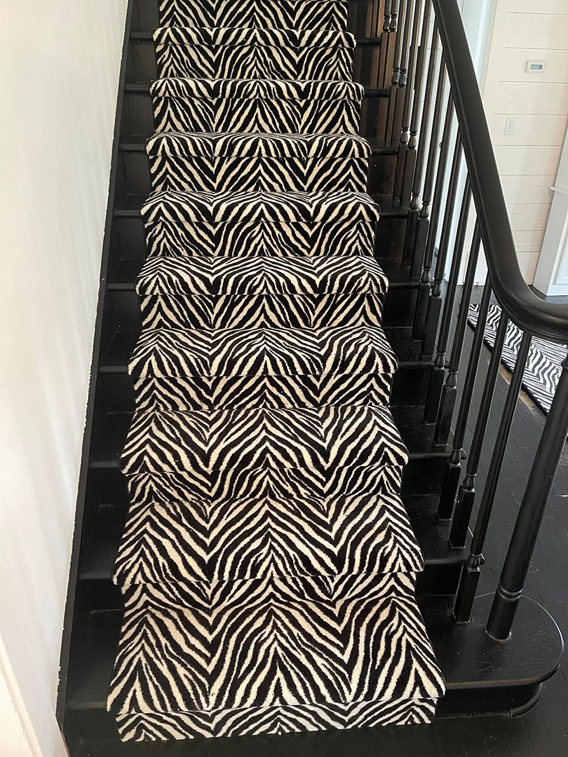Zebra print carpet stair runner. 